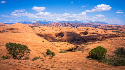 hiking the pothole arch trail near moab in utah, usa