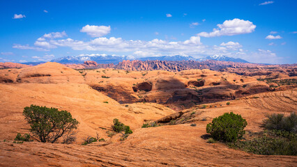 hiking the pothole arch trail near moab in utah, usa