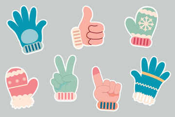 A set of stickers featuring a child's hand in cute winter mittens or gloves, demonstrating different gestures, in cozy winter colors.