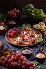 Fresh mediterranean salad with figs, grapes, cheese, and watermelon radish