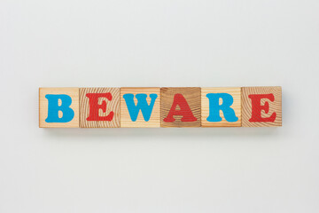 Wooden Blocks Show the Word Beware