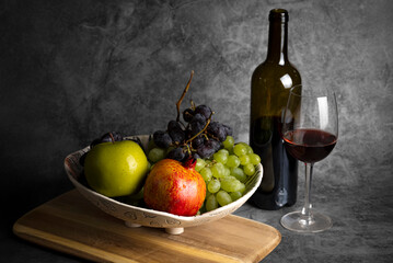 Composition with wine and fruits - grapes, pomegranate and apple