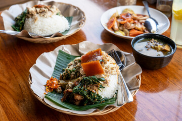 Roasted pork with rice and vegetables or nasi campur babi guling Balinese food