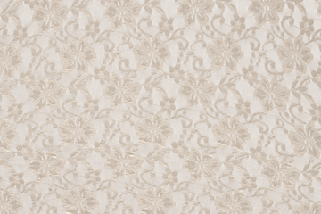 Delicate floral lace fabric with a transparent pattern, ideal as an overlay or decorative background for design projects