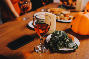 Joyful office Halloween party with coworkers in costumes, celebrating with drinks and laughter, fostering teamwork and festive spirit