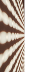 A mesmerizing abstract pattern of glowing dots stretches across a dark wall, creating a sense of depth and movement. The geometric lines and luminous effect evoke modern art and visual intrigue.

