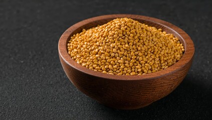 Golden Grains in Wooden Bowl Textured Dark Background, CloseUp View, Simple Still Life.
