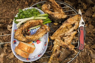 Cooked food. Top view. Cooked fish on fire.