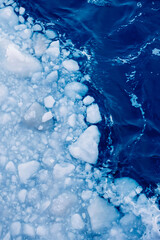 Cracked Ice in Deep Blue Ocean (Top View)
