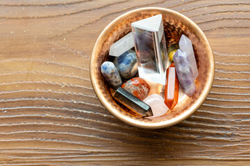 Close-Up of Various Natural Stones and Crystals in a Copper Bowl
