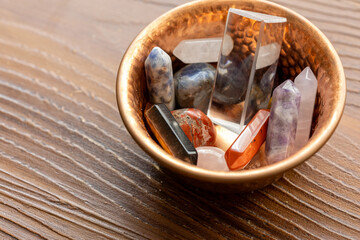 Close-Up of Various Natural Stones and Crystals in a Copper Bowl

