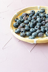 Close-Up of Wild Blueberries in a Wooden Bowl

