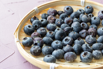 Close-Up of Wild Blueberries in a Wooden Bowl
