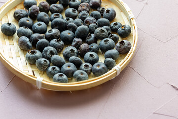 Close-Up of Wild Blueberries in a Wooden Bowl
