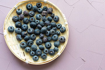 Close-Up of Wild Blueberries in a Wooden Bowl
