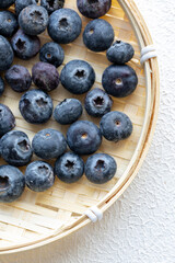 Close-Up of Wild Blueberries in a Wooden Bowl
