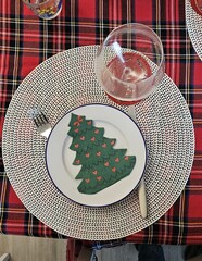 table set and decorated with Christmas decorations to celebrate Holy Christmas and the end of the year
