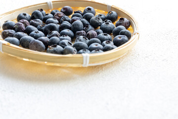 Close-Up of Wild Blueberries in a Wooden Bowl
