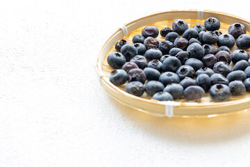 Close-Up of Wild Blueberries in a Wooden Bowl
