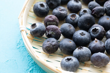 Close-Up of Wild Blueberries in a Wooden Bowl
