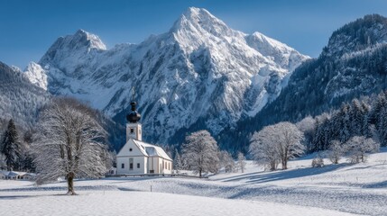 alpine church in snowy mountain valley,