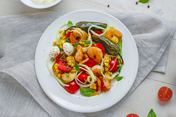 Healthy seafood zucchini pasta bowl with shrimp, grilled pepper, and fresh vegetables