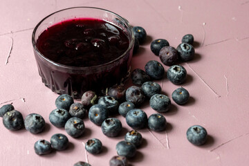 Close-Up of Wild Blueberry Jam with Fresh Blueberries on the Side
