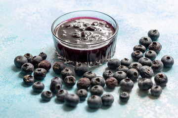 Close-Up of Wild Blueberry Jam with Fresh Blueberries on the Side
