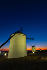 Campo de Criptana windmills standing at sunset over La Mancha