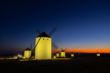 Campo de Criptana windmills illuminated at blue hour