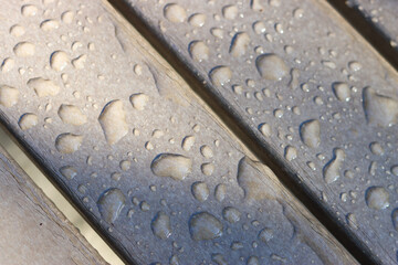 Grey composite furniture  boards just after a storm. 