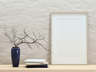 Mock up poster frame on white plaster wall with branches in vase and books on wooden shelf, portrait orientation, stylish frame mock up, 3d rendering, 3d illustration