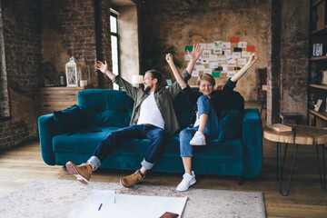 Tech‑savvy duo reviews UX wireframe on laptop, evaluating interactive design, A/B testing flow,...