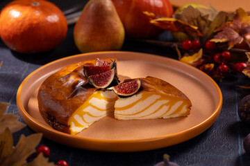 Pumpkin cheesecake with figs featuring autumn decorations
