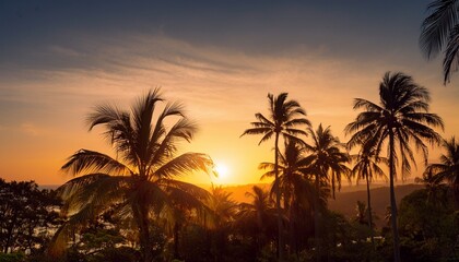 Obraz premium Golden Sunset Silhouetting Tropical Palm Trees In A Serene Nature Setting