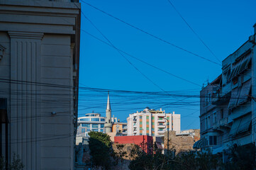 Minaret of The Old Mosque, Fatih Mosque, in Durres with chaotic overhead cables