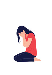 A person kneels on the floor covering their face with their hands in despair.