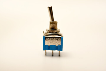 Small electric switches. Electric toggle switch. Blue switches.