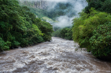 Scenic dramatic view with the powerful waters of Urubamba River crossing the Sacred Valley in Aguas Calientes