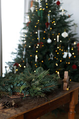 Making Christmas wreath. Christmas wreath with fir, pine and cedar branches, scissors and rustic...
