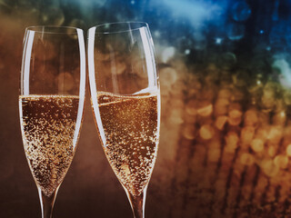 toasting with champagne glasses against holiday lights