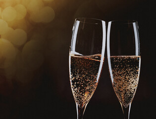 toasting with champagne glasses against holiday lights