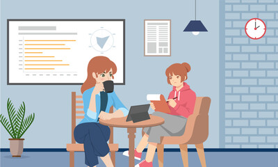 Two women working together in...