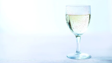 stemware. Elegant white wine glass placed simply on a clean table, capturing refined sophistication. bar promotions, beverage menus, designed for food & beverage menus and cafe branding.
