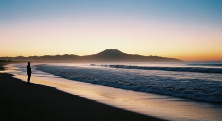 Tranquil sunrise by the beach with silhouette reflection and waves for serenity and calmness