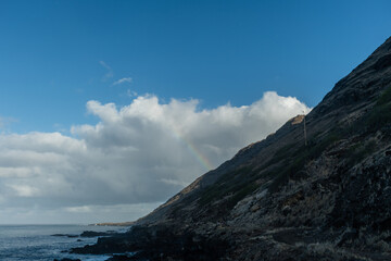 Beautiful rainbow viewed from the Kaena Point trail on Oahu, Hawaii	
