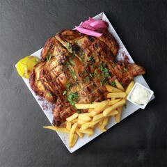 Grilled Charcoal Chicken Served Fresh on Traditional Platter &mdash; Juicy Barbecue Chicken with Smoky Flavor
