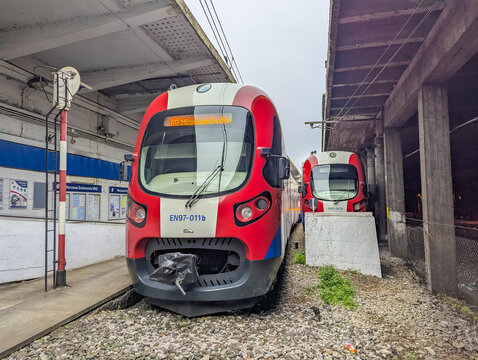 Warsaw, Poland, October 20, 2025. Red white and blue Warszawska Kolej Dojazdowa passenger train stopped at urban railway platform Warsaw Poland. High quality photograph
