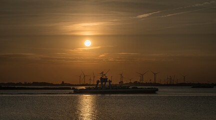 Sunset with a ferry on the river Elbe.