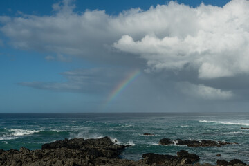 Scenic panoramic Kaena Point State Park vista with a beautiful rainbow in the background, Oahu, Hawaii	